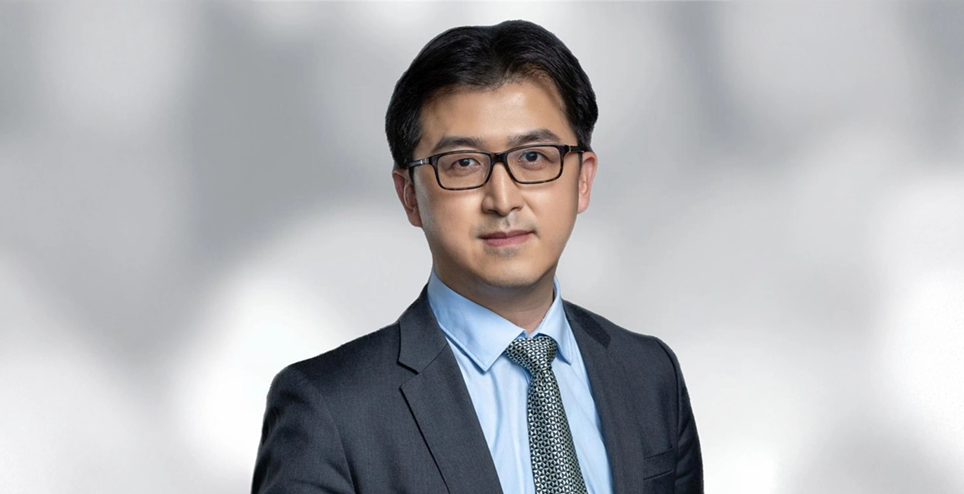 Dr. Lai Wang, Global Head of R&D, representing leadership in cancer research.